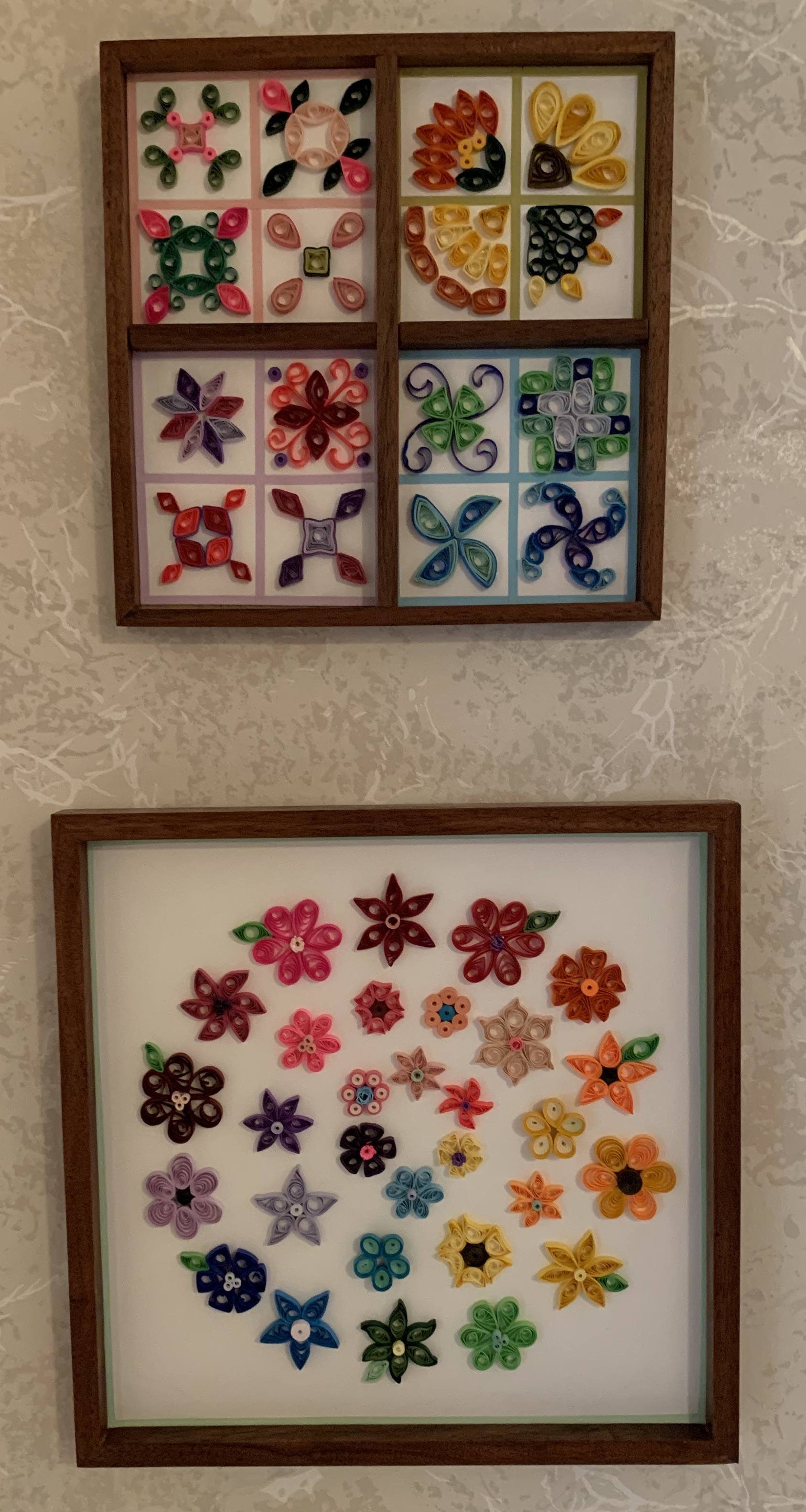 Quilling pictures hung on wall